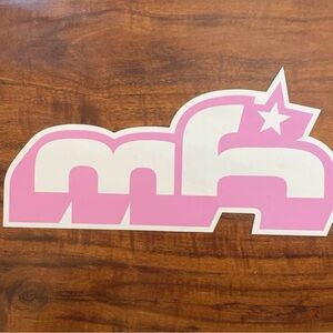 Pink and white “mh” sticker